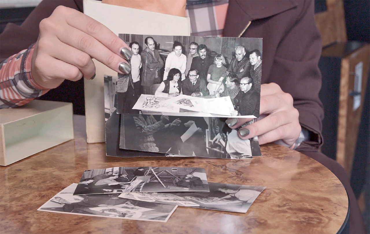 Henrike Naumann with photos documenting the “Bitterfelder Weg,” 2022