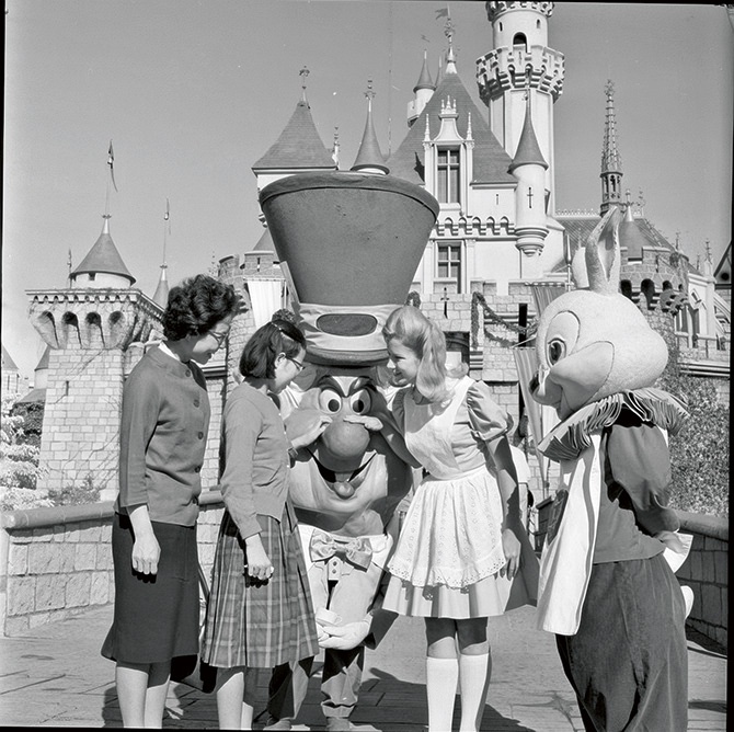 Visitors and cast members at Disneyland, Anaheim, 1964