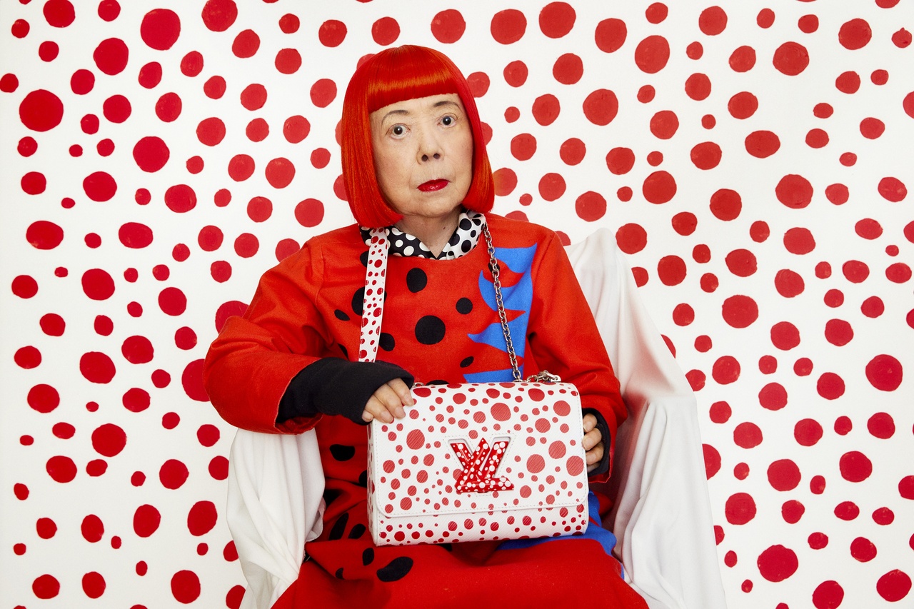 People use their smartphones to take pictures of the Yayoi Kusama