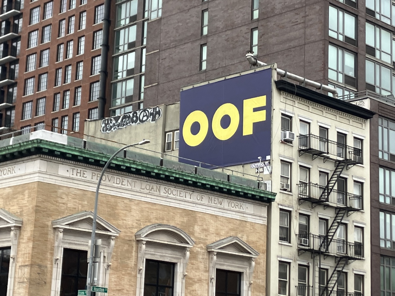 Advertisement for “Ed Ruscha: Now Then” on the corner of Essex and E Houston (The adjacent former building of Provident Loan Society was once used by Jasper Johns as his studio), 2023